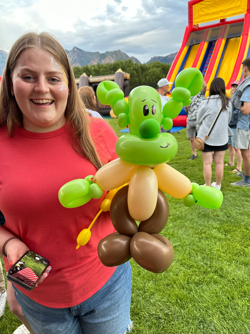 Large balloon twisting creation with multiple shaped balloons