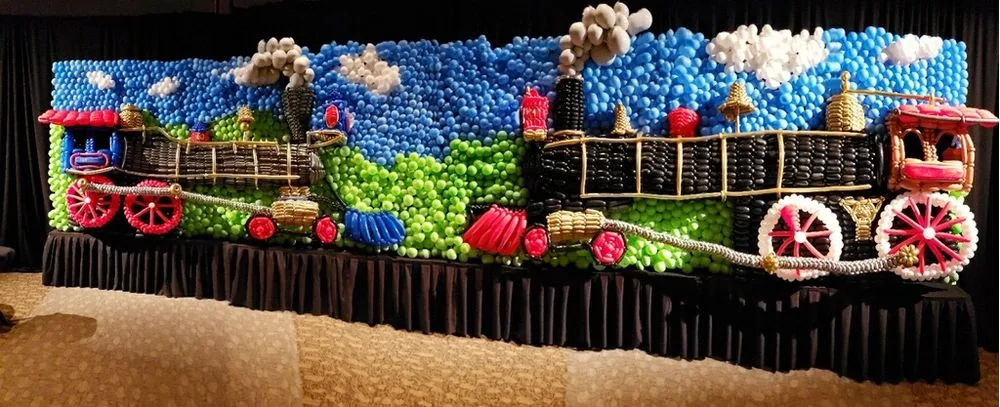 Two train balloon sculptures for a custom event display